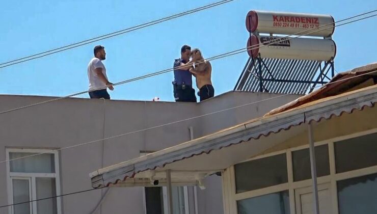 Polis çatıya çıkan adamı indirmek için uzun süre dil döktü